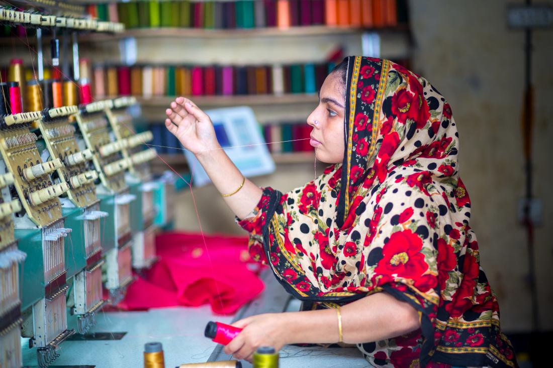 Woman working in a Bangladeshi garment factory.