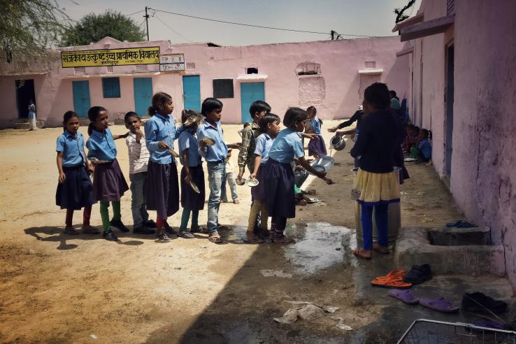 Children waiting in line to wash their hands 